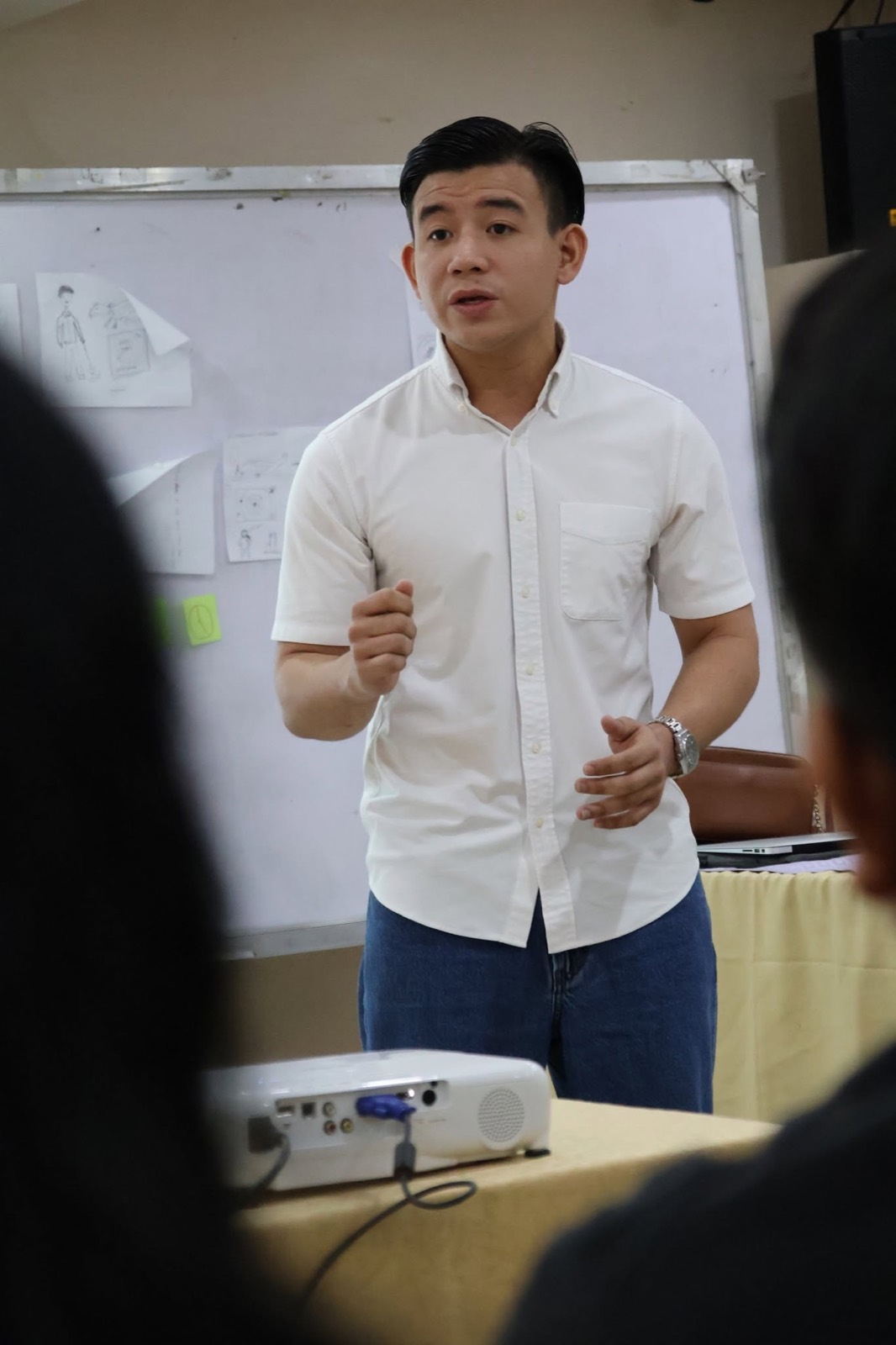 A facilitator speaks to a workshop audience.
