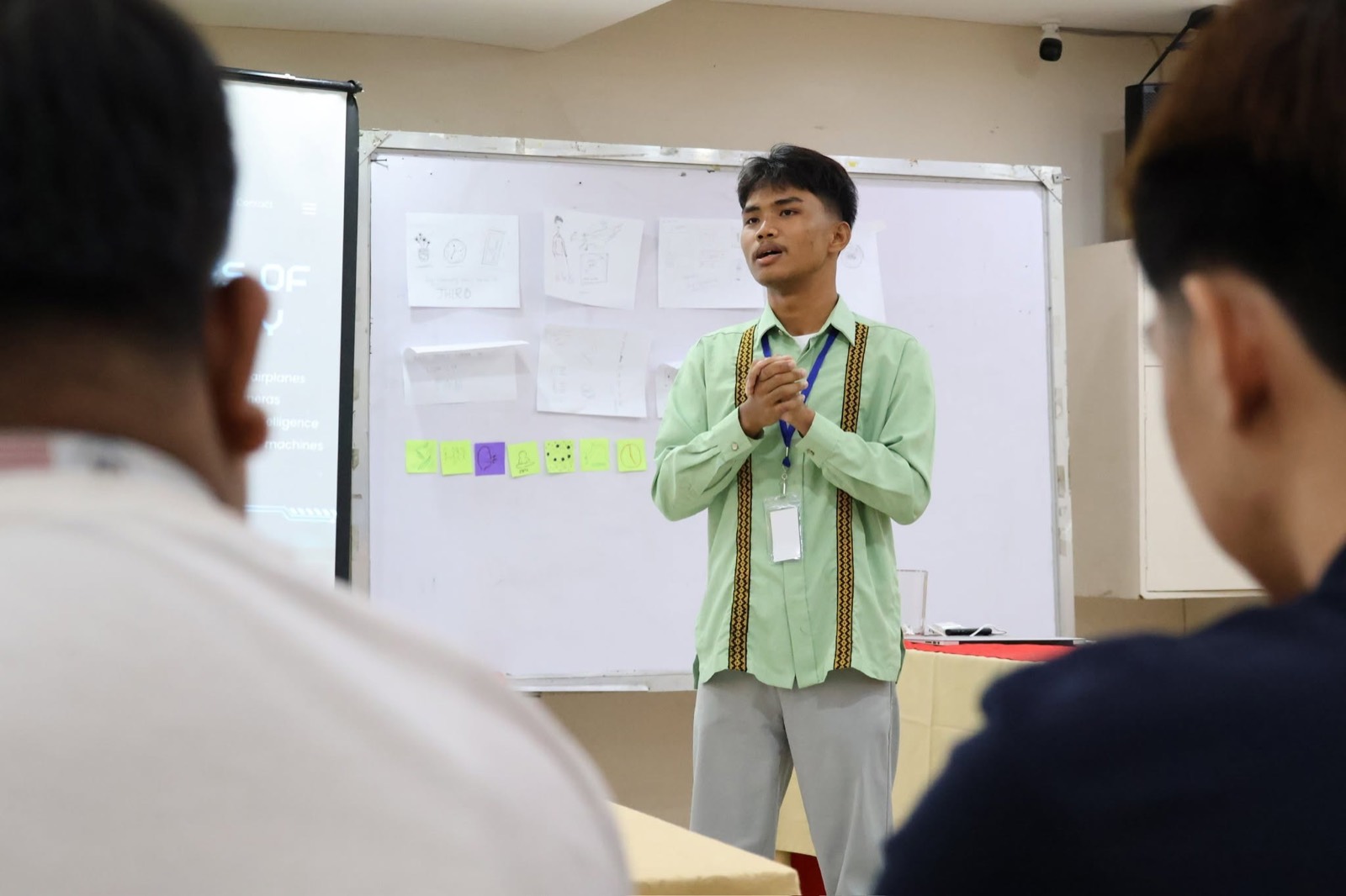 A young participant presents his ideas at a peace leadership workshop.