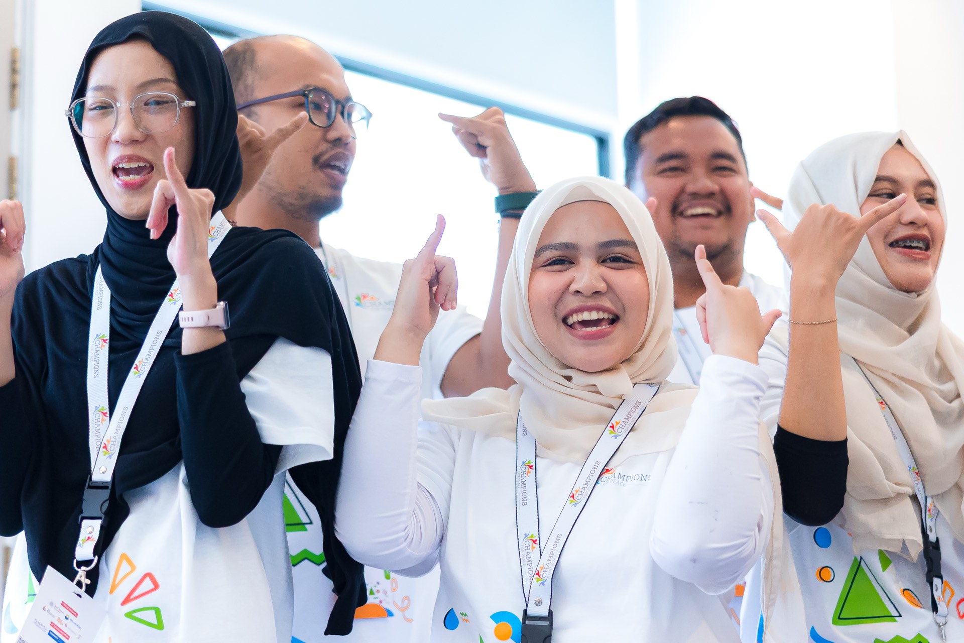 Delegates cheer together between sessions at the Regional Conference.