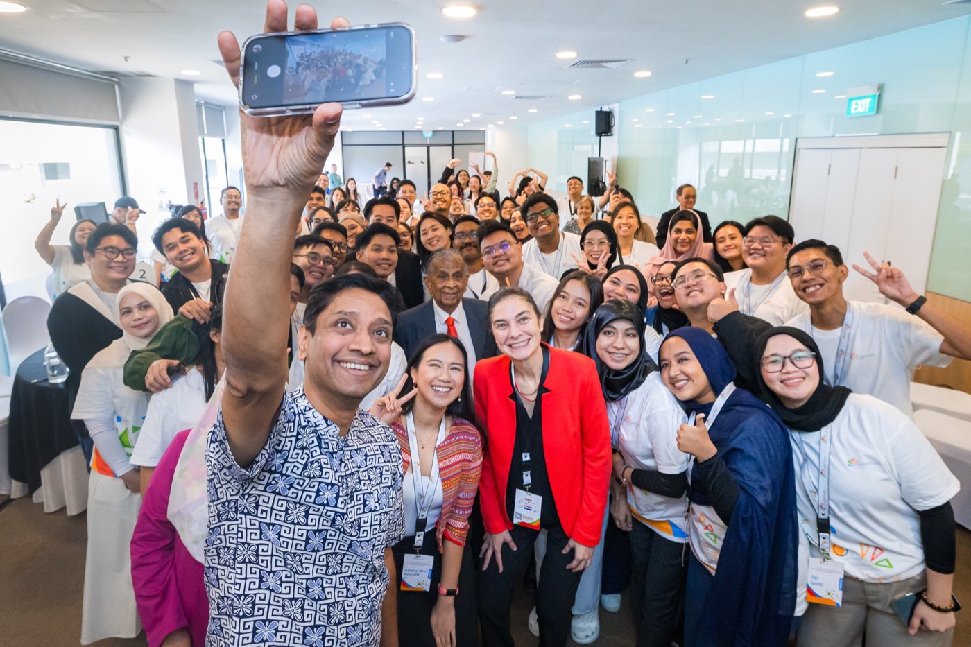 Delegates from five countries take a group selfie at the Champions for Peace Regional Conference, Singapore.