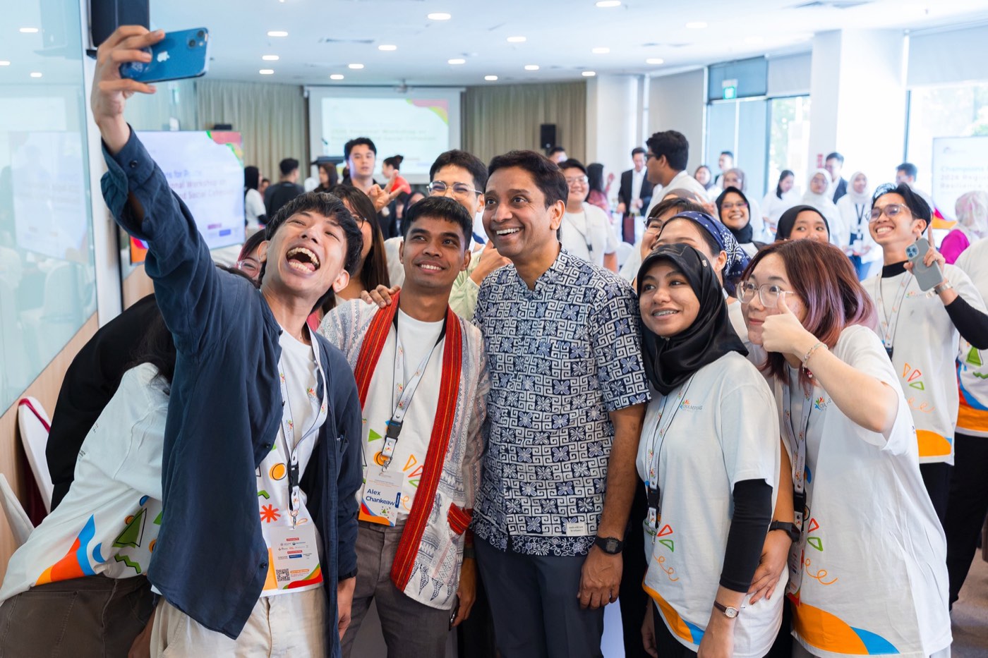 Youth delegates take a selfie with a guest speaker in Singapore.