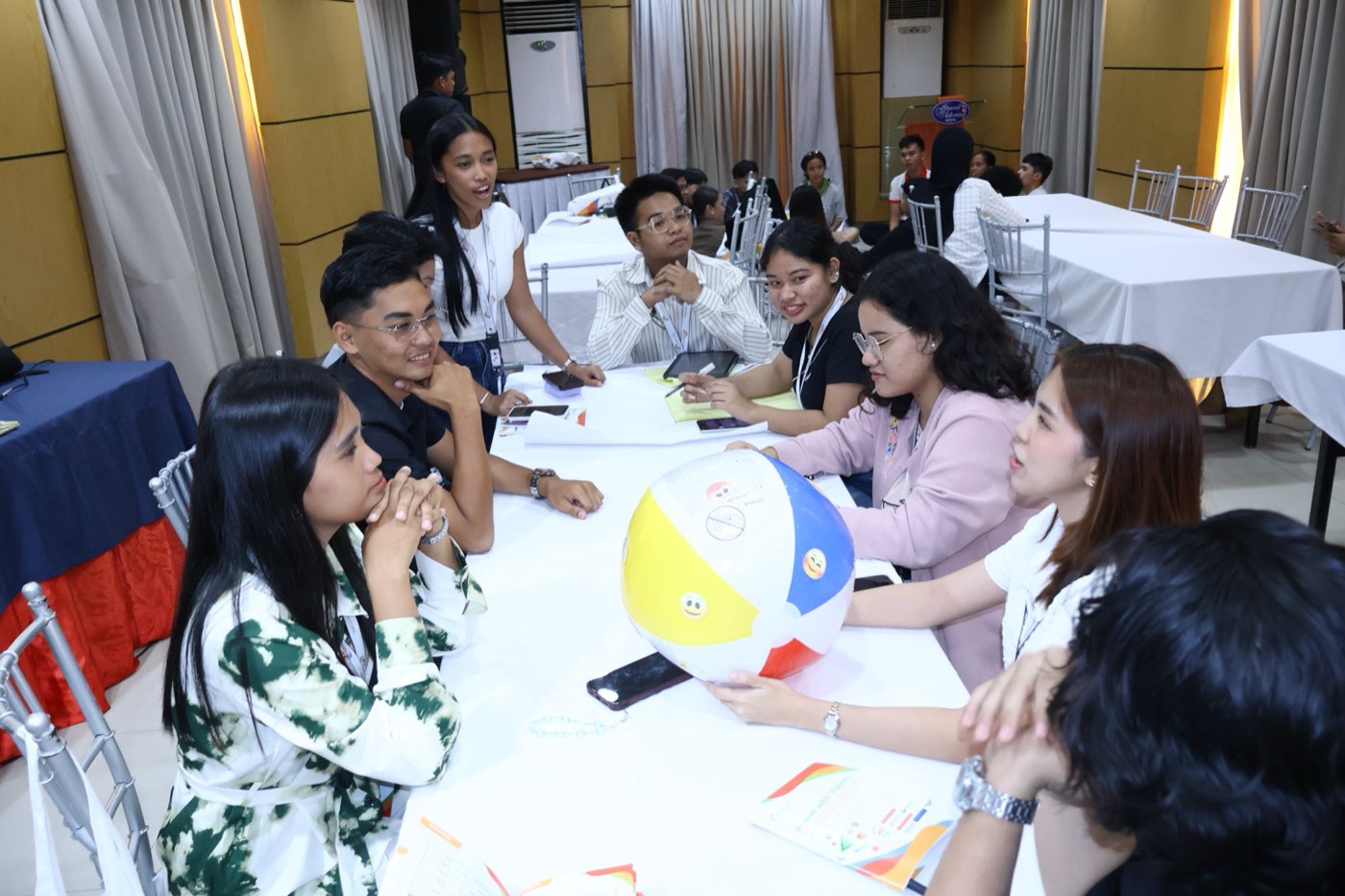 Facilitators guide a small-group discussion during Champions for Peace training.