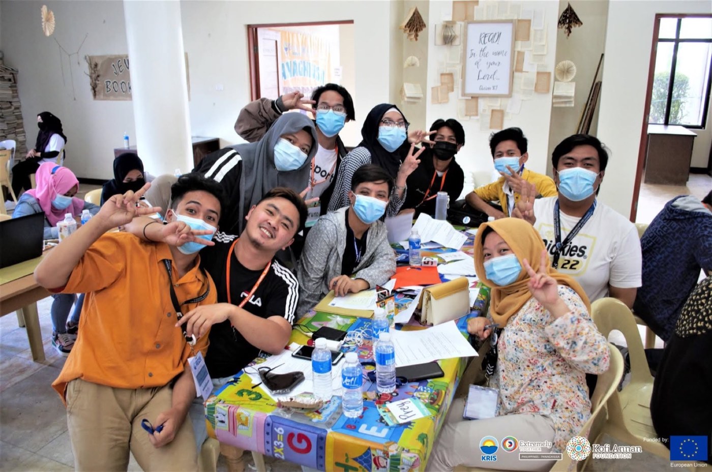 Youth participants smile and flash peace signs at an Extremely Together Philippines peace camp.