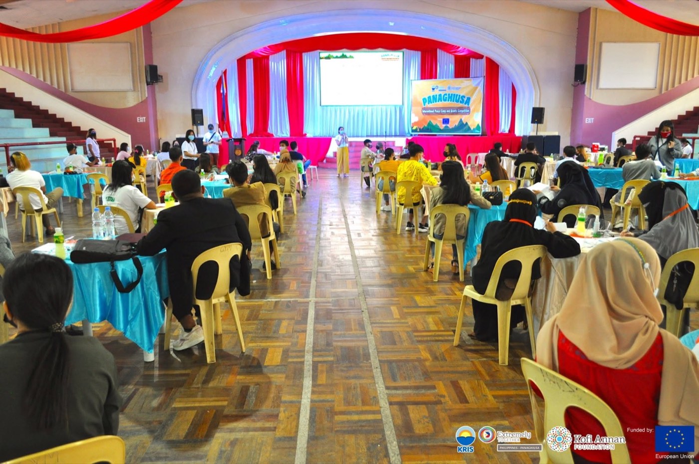 Youth participants gather in a hall at the Panaghiusa International Peace Camp and Grants Competition.