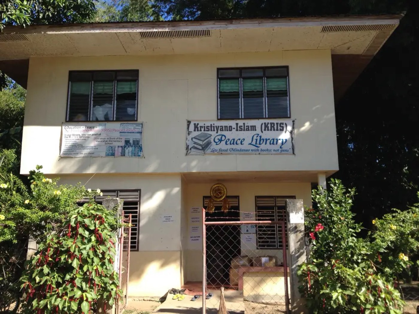The first Kristiyano-Islam (KRIS) Peace Library in Manicahan, Zamboanga City, with its banner reading 'Let's flood Mindanao with books, not guns.'